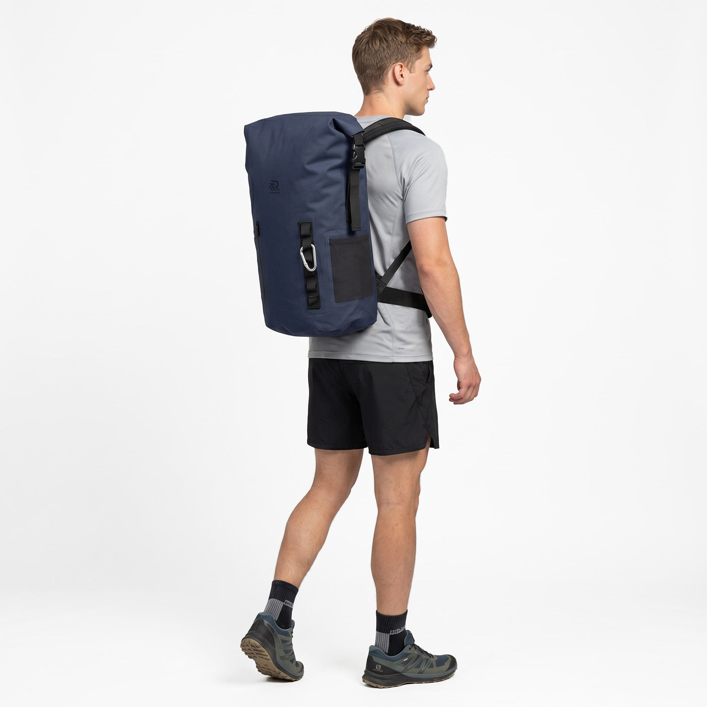 Back view of a man wearing a RIVONOVA 35L Roll-Top Backpack Cooler#Size_35L#Color_navy