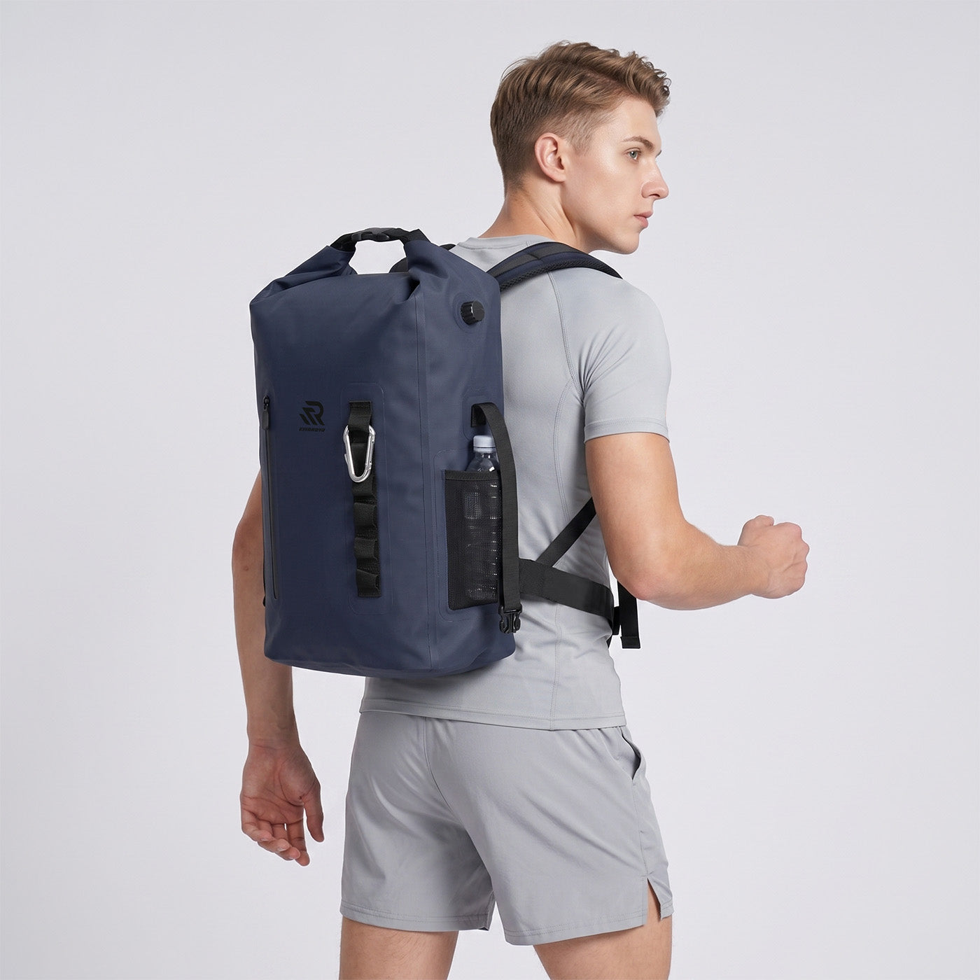RIVONOVA 20L Roll-Top Backpack Cooler in Navy - side view worn#Size_20L#Color_navy
