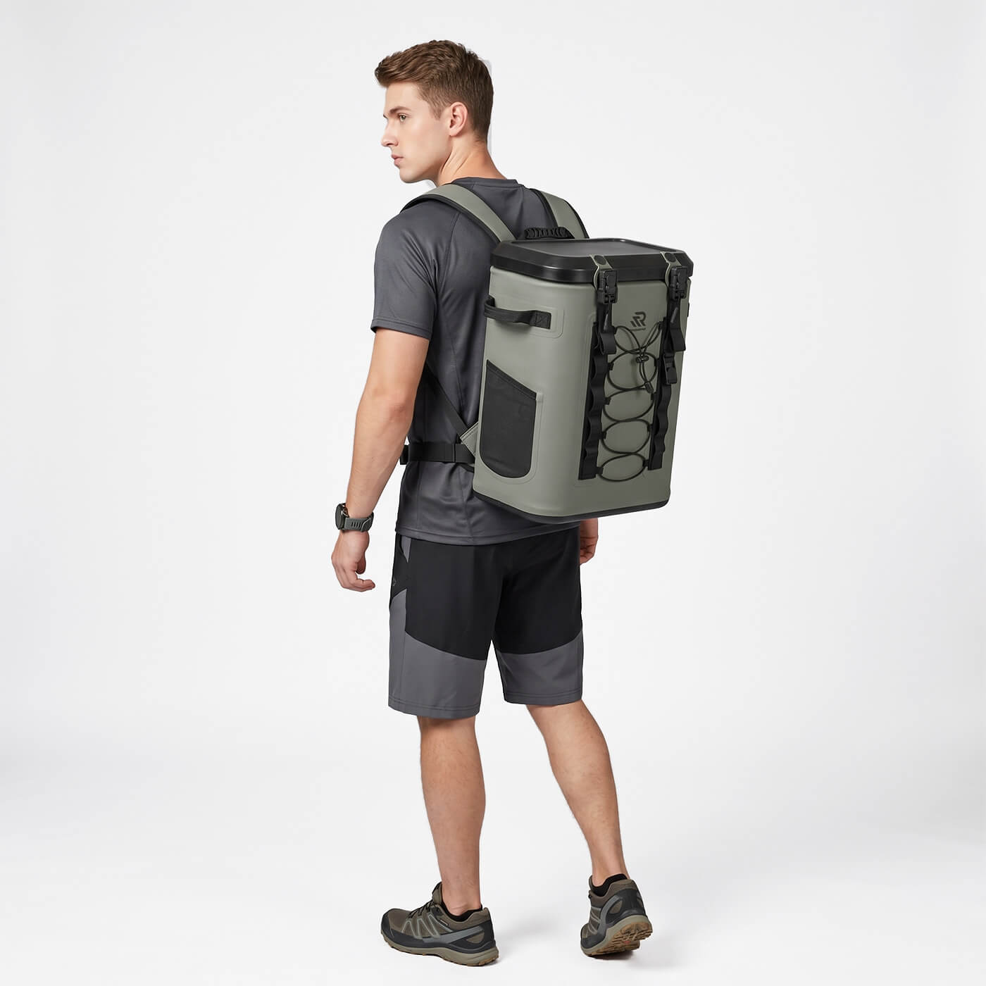 Back view of a man wearing a Rivonova 24can magnetic soft cooler#Color_Green