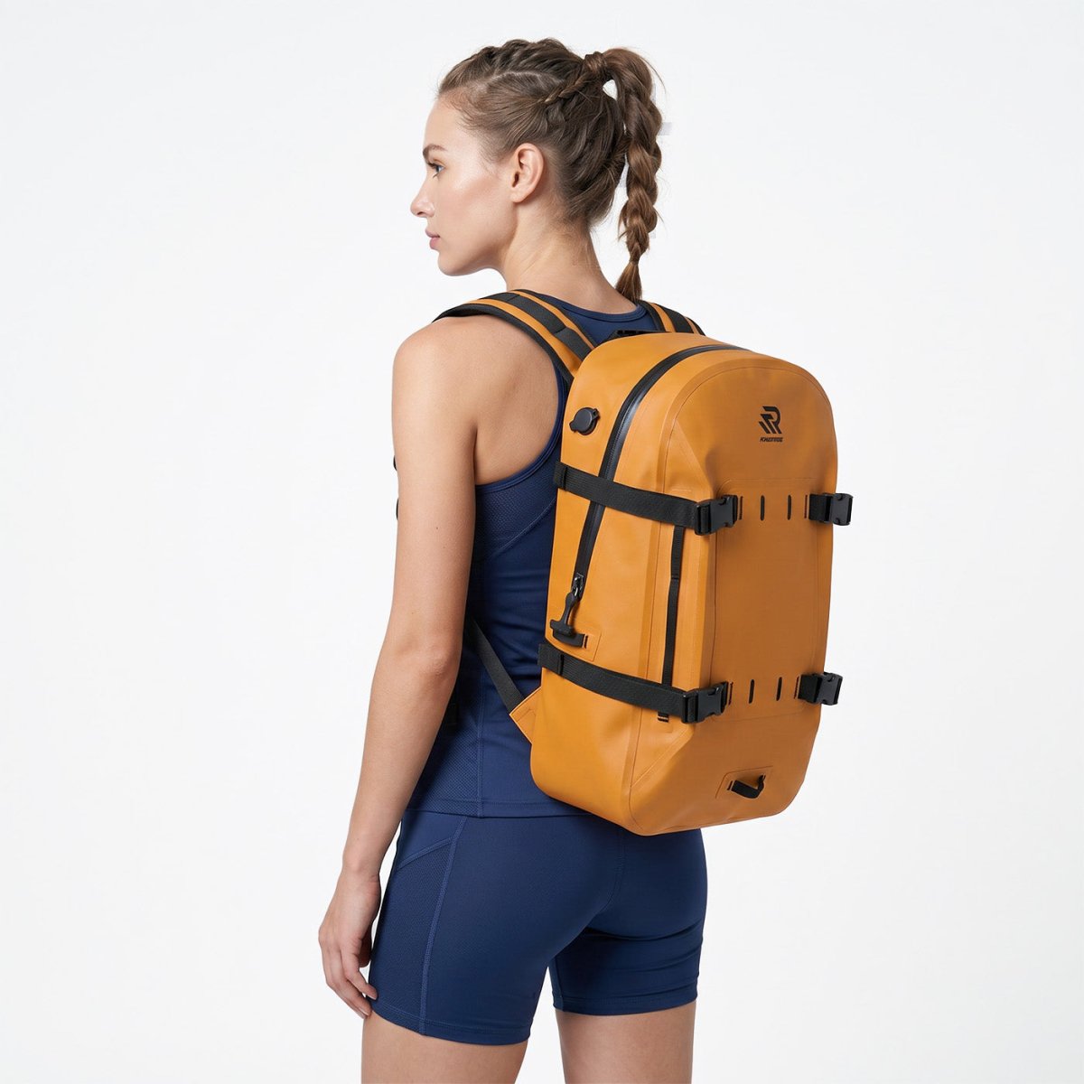 Back view of a woman wearing a Rivonova 30L waterproof backpack#Color_Orange