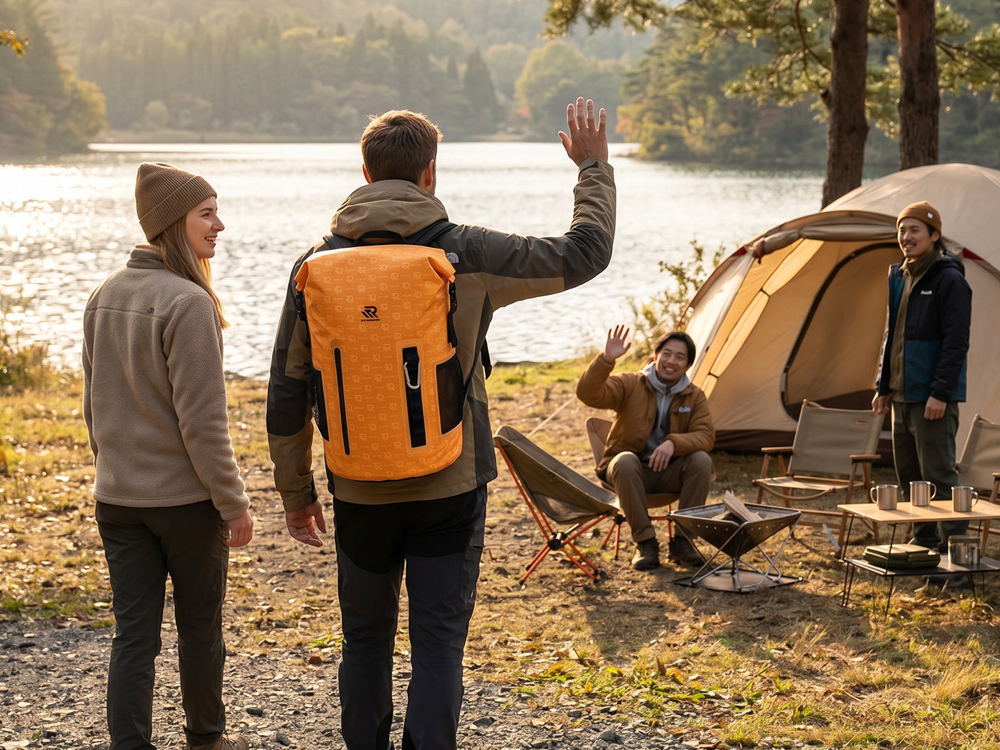 man carrying a roll top backpack cooler for camping with friends beside lake