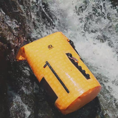 RIVONOVA Roll-top backpack cooler tested under waterfall spray and direct sunlight for durable outdoor performance